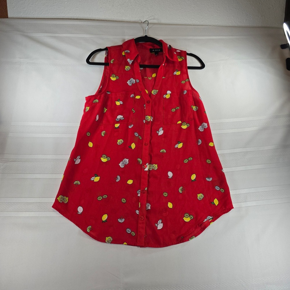 A Byer red sleeveless button-down shirt with lemons